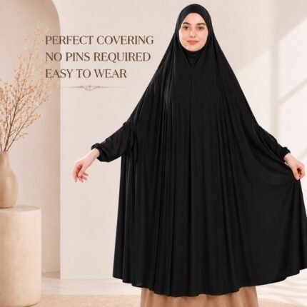A woman wearing a jersey Hajj Umrah Scarf with Sleeves, providing full coverage for the head, neck, and shoulders without pins. By CLOTHIFYDOTPK