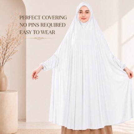 A woman wearing a white jersey Hajj Umrah Scarf with Sleeves, providing full coverage for the head, neck, and shoulders without pins. By CLOTHIFYDOTPK
