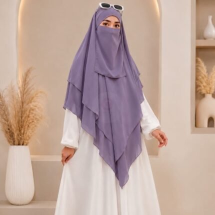 A women wearing flowing 3 layer khimar Hijab, made of three separate layers of chiffon. By Clothifydotpk