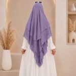 A women wearing flowing 3 layer khimar Hijab, made of three separate layers of chiffon. By Clothifydotpk
