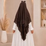 A women wearing flowing 3 layer khimar Hijab, made of three separate layers of chiffon. By Clothifydotpk