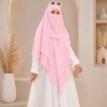 A women wearing flowing three layer khimar Hijab, made of three separate layers of chiffon. By Clothifydotpk