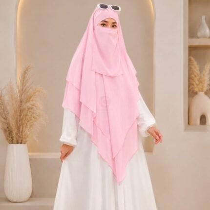 A women wearing flowing three layer khimar Hijab, made of three separate layers of chiffon. By Clothifydotpk