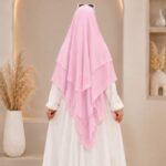 A women wearing flowing three layer khimar Hijab, made of three separate layers of chiffon. By Clothifydotpk