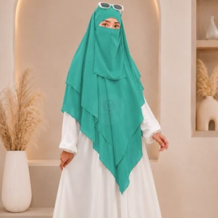 A women wearing flowing Three layer long khimar Hijab, made of three separate layers of chiffon. By Clothifydotpk