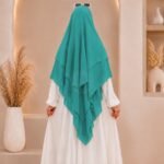 A women wearing flowing Three layer long khimar Hijab, made of three separate layers of chiffon. By Clothifydotpk