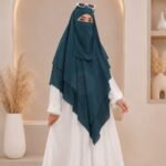 A women wearing flowing khimar three layer Hijab set, made of three separate layers of chiffon - Buy Khimar Online Pakistan - By Clothifydotpk