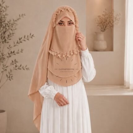 A woman wearing a soft, Chiffon instant Crown hijab with Niqab, draped smoothly around her head and shoulders with no visible pins. BY CLOTHIFYDOTPK