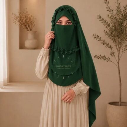 A woman wearing a soft, Chiffon instant Crown hijab with Niqab, draped smoothly around her head and shoulders with no visible pins. BY CLOTHIFYDOTPK