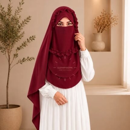A woman wearing a soft, Chiffon instant Crown hijab with Niqab, draped smoothly around her head and shoulders with no visible pins. BY CLOTHIFYDOTPK