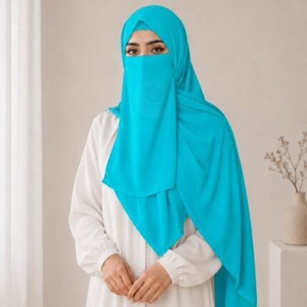 A woman wearing a complete 3 piece hijab set with a niqab covering her face, leaving only eyes visible. The set includes an underscarf, outer scarf and separate niqab. By CLOTHIFYDOTPK