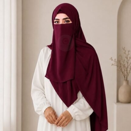 A woman wearing a complete 3 piece hijab set with a niqab covering her face, leaving only eyes visible. The set includes an underscarf, outer scarf and separate niqab. By CLOTHIFYDOTPK