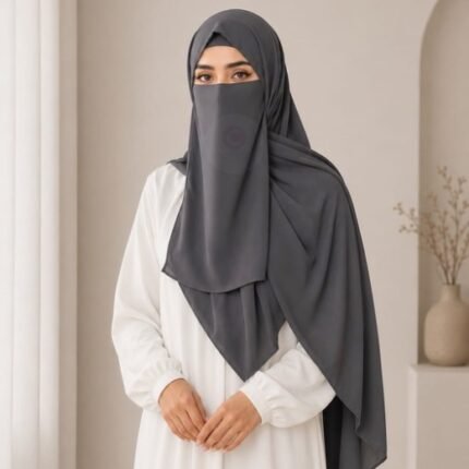 A woman wearing a complete 3 piece hijab set with a niqab covering her face, leaving only eyes visible. The set includes an underscarf, outer scarf and separate niqab. By CLOTHIFYDOTPK