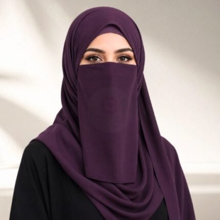 A woman wearing a complete three piece hijab set with a niqab covering her face, leaving only eyes visible. The set includes an underscarf, outer scarf and separate niqab. By CLOTHIFYDOTPK