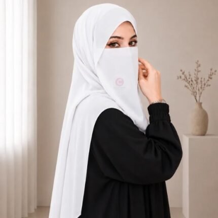 A woman wearing a complete 2 piece hijab set with a niqab covering her face, leaving only eyes visible. The set includes an Hijab and separate niqab. By CLOTHIFYDOTPK