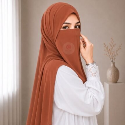 A woman wearing a complete 2 piece hijab set with a niqab covering her face, leaving only eyes visible. The set includes an Hijab and separate niqab. By CLOTHIFYDOTPK