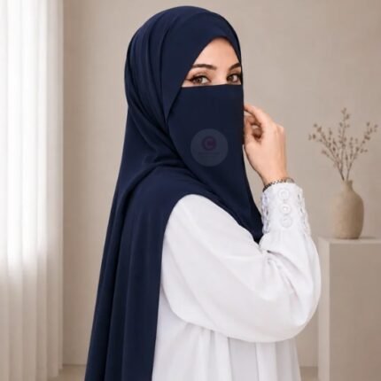 A woman wearing a complete 2 piece hijab set with a niqab covering her face, leaving only eyes visible. The set includes an Hijab and separate niqab. By CLOTHIFYDOTPK