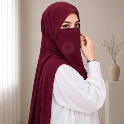 A woman wearing a complete 2 piece hijab set with a niqab covering her face, leaving only eyes visible. The set includes an Hijab and separate niqab. By CLOTHIFYDOTPK