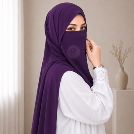 A woman wearing a complete two piece hijab set with a niqab covering her face, leaving only eyes visible. The set includes an Hijab and separate niqab. By CLOTHIFYDOTPK