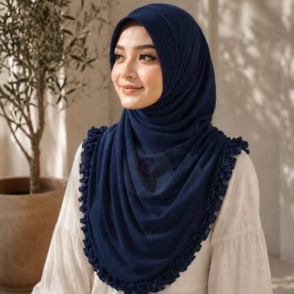 A woman wearing a soft, stretchy instant hijab, draped smoothly around her head and shoulders with no visible pins or wrapping layers.