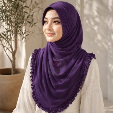 A woman wearing a soft, stretchy instant hijab, draped smoothly around her head and shoulders with no visible pins or wrapping layers.