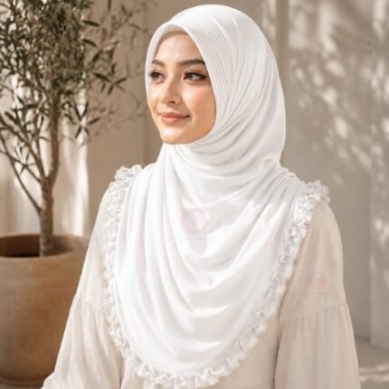 A woman wearing a soft, stretchy instant hijab, draped smoothly around her head and shoulders with no visible pins or wrapping layers. BY CLOTHIFYDOTPK