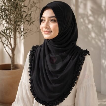 A woman wearing a soft, stretchy instant hijab, draped smoothly around her head and shoulders with no visible pins or wrapping layers.