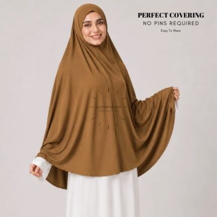 A woman wearing a Mustard jersey Hajj and Umrah scarf – a Namaz Makhna hijab designed for head, neck and shoulder coverage without the need for pins. By CLOTHIFYDOTPK