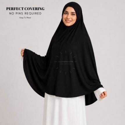 A woman wearing a Black jersey Hajj and Umrah scarf – a Namaz Makhna hijab designed for head, neck and shoulder coverage without the need for pins. By CLOTHIFYDOTPK
