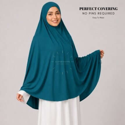 A woman wearing a Teal jersey Hajj and Umrah scarf – a Makhna hijab designed for head, neck and shoulder coverage without the need for pins. By CLOTHIFYDOTPK