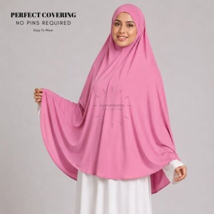 A woman wearing a Blush jersey Hajj and Umrah scarf – a Namaz Makhna hijab designed for head, neck and shoulder coverage without the need for pins. By CLOTHIFYDOTPK