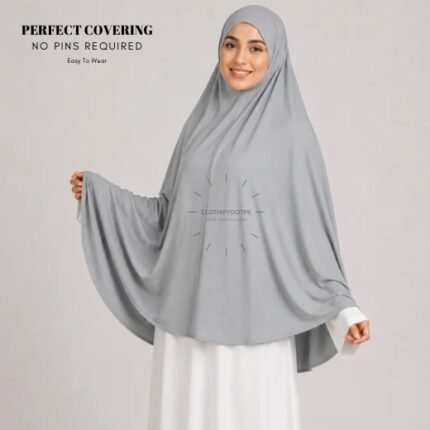 A woman wearing a Light Gray jersey Hajj and Umrah scarf – a Namaz Makhna hijab designed for head, neck and shoulder coverage without the need for pins. By CLOTHIFYDOTPK
