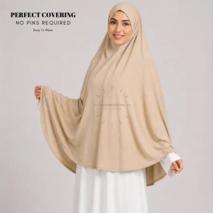 A woman wearing a Beige jersey Hajj and Umrah scarf – a Namaz Makhna hijab designed for head, neck and shoulder coverage without the need for pins. By CLOTHIFYDOTPK