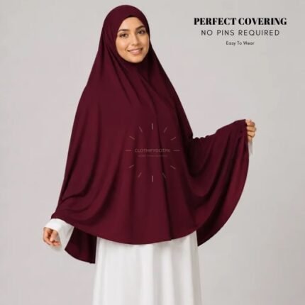 A woman wearing a Maroon jersey Hajj and Umrah scarf – a Namaz Makhna hijab designed for head, neck and shoulder coverage without the need for pins. By CLOTHIFYDOTPK