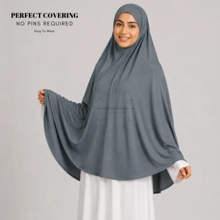 A woman wearing a Dark Gray jersey Hajj and Umrah scarf – a Namaz Makhna hijab designed for head, neck and shoulder coverage without the need for pins. By CLOTHIFYDOTPK