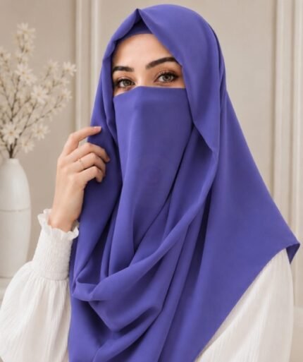 A woman wearing a Indigo color Misri hijab draped over the head and shoulders with attached Niqab. Buy Misri Hijab Online in Pakistan