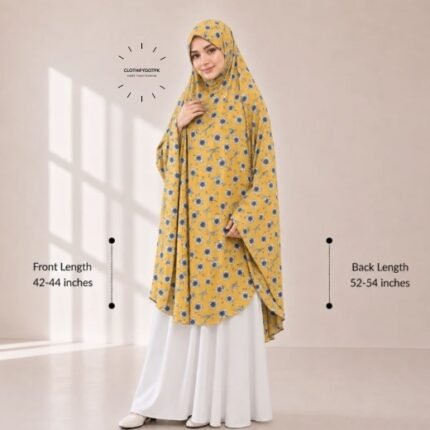 A woman draped in a soft Swiss lawn namaz chadar without sleeves also known as Makhna Hijab or Namaz Scarf with front coverage that falls above the knees, while the back extends down till knees. BY CLOTHIFYDOTPK