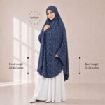A woman draped in a soft Swiss lawn namaz chadar without sleeves also known as Makhna Hijab or Namaz Scarf with front coverage that falls above the knees, while the back extends down till knees. BY CLOTHIFYDOTPK