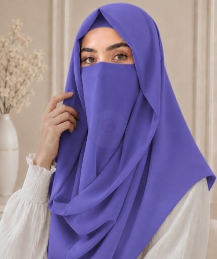 Stylish woman wearing a luxury Misri hijab Niqab or ninja nectar set with coordinated underscarf and flowing drape. BY CLOTHIFYDOTPK