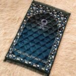 This beautifully designed, quilted prayer mat offers premium padding and is shown flat - courtesy of CLOTHIFYDOTPK.