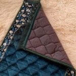 This beautifully designed, quilted prayer mat offers premium padding and is shown flat - courtesy of CLOTHIFYDOTPK.
