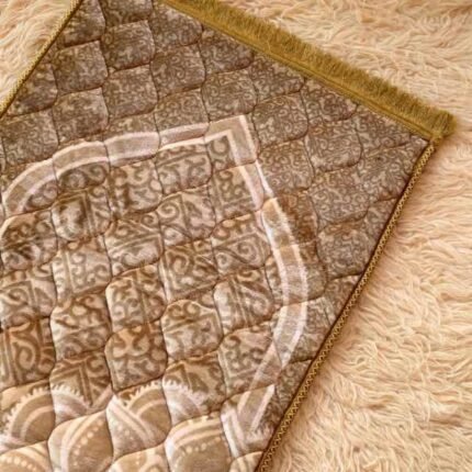 This beautifully designed, quilted prayer mat offers premium padding and is shown flat - courtesy of CLOTHIFYDOTPK.