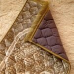 This beautifully designed, quilted prayer mat offers premium padding and is shown flat - courtesy of CLOTHIFYDOTPK.