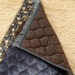 This beautifully designed, quilted prayer mat offers premium padding and is shown flat - courtesy of CLOTHIFYDOTPK.