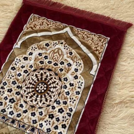 This beautifully designed, quilted prayer mat offers premium padding and is shown flat - courtesy of CLOTHIFYDOTPK.