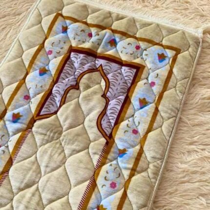 This beautifully designed, quilted prayer mat offers premium padding and is shown flat - courtesy of CLOTHIFYDOTPK.