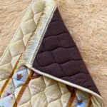 This beautifully designed, quilted prayer mat offers premium padding and is shown flat - courtesy of CLOTHIFYDOTPK.