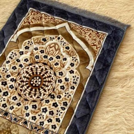 This beautifully designed, quilted prayer mat offers premium padding and is shown flat - courtesy of CLOTHIFYDOTPK.