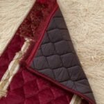 This beautifully designed, quilted prayer mat offers premium padding and is shown flat - courtesy of CLOTHIFYDOTPK.