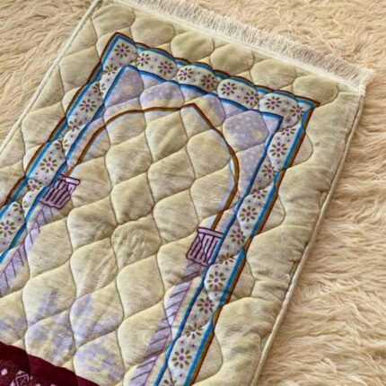 This beautifully designed, quilted prayer mat offers premium padding and is shown flat - courtesy of CLOTHIFYDOTPK.